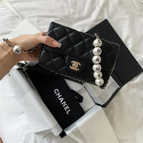 chanel belt bag with gold chain|Chanel bag with pearl chain.